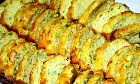 sliece of a vegetable and cheese pie
