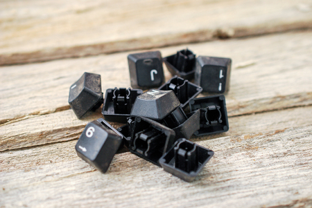 computer keyboard buttons on old wood background,image