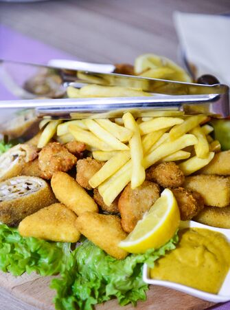 delicious catering food set on wooden platter