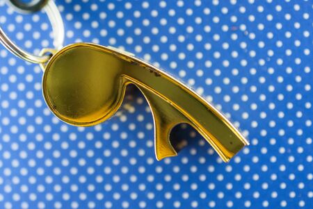 old used gold colored soccer referee whistle