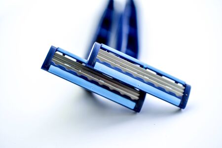 new blue blade razor on white background imageの写真素材