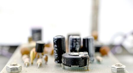 Dusty and dirty vintage electronics background with resisters, capacitors,diodes and other components.の写真素材