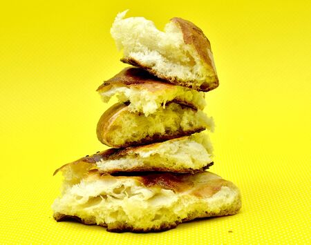 fresh baked bread isolated on yellow backgroundの写真素材