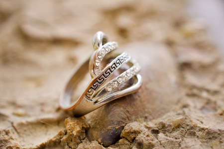 cheap used ring bijouterie on sea shellの写真素材