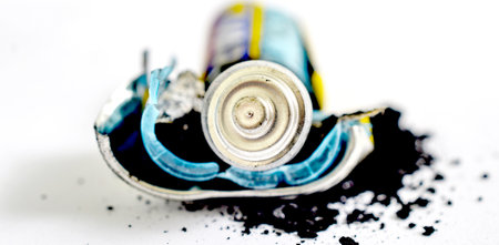 disassembled AA battery close up on a white background imageの写真素材