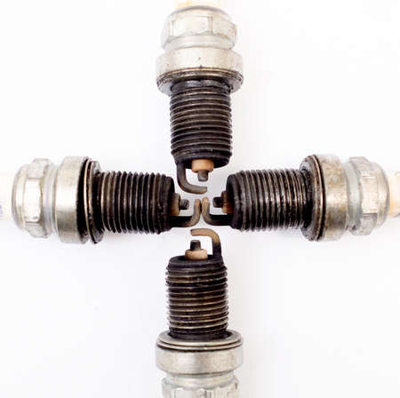 closeup shot of used spark plug on white background.の写真素材