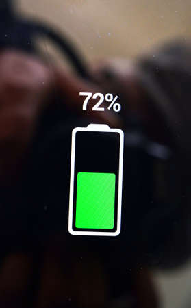 energy concept, battery level indicator on a smartphone display imageの写真素材