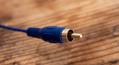 audio-video analog cable on an old wood table background.の写真素材