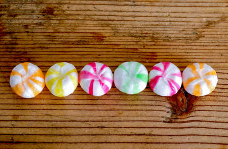 traditional sweets bonbons on wood background imageの写真素材