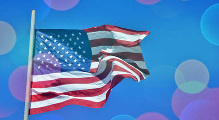 USA flag against blue sky National United State of America flag Bokeh circlesの写真素材