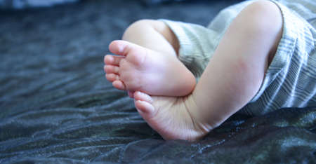 cute feets of a baby .
