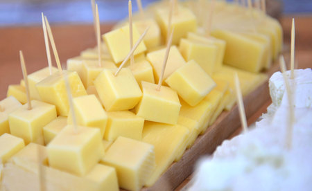 sheep cheese pieces cheese on a platter.