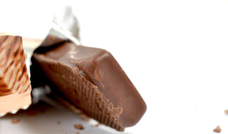 Closeup of chocolate bar isolated on white.の写真素材