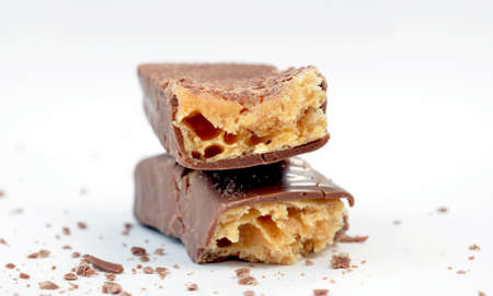 Closeup of chocolate bar isolated on white.