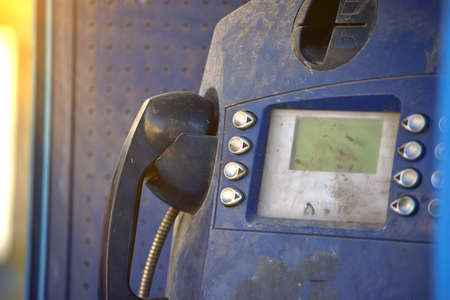out of order abandoned public phone set with dirt and scratchesの写真素材