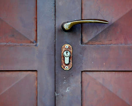 Closeup metal door with lock in grungy style and good textureの写真素材