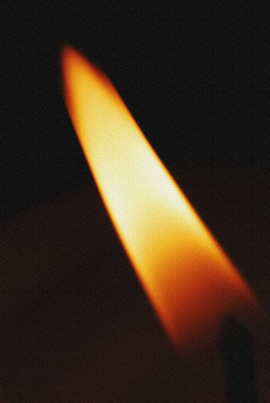 A close up of a lit match on a black background with copy space.の写真素材