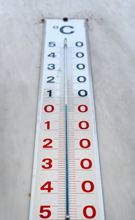 outdoor thermometer is to zero celsius degree, climate concept.の写真素材