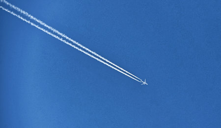 airplane on blue sky, transportation concept.の写真素材