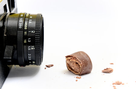 vintage camera and chocolate sweet food on white background.