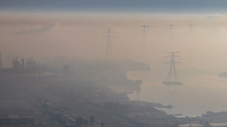 New Sheikh Khalifa Bridge in Abu Dhabi timelapse aerial view from above, United Arab Emirates. Traffic on the road at foggy morningの写真素材
