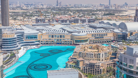 Dubai downtown at sunny day timelapse, luxury modern buildings and fountains, futuristic cityscape of United Arab Emirates. Aerial top view from skyscraperのeditorial素材