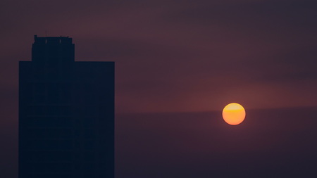 Foggy morning sunrise in downtown of Dubai timelapse. Futuristic view of the city skyscrapers covered in mist. Aerial view from rooftop with modern towers. Dubai, UAEの写真素材