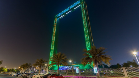 Dubai Frame building at night timelapse with illumination, new UAE attraction. View from car parking aith palms. The frame measures 150 meters high and 93 meters wide and its new Dubai attractionのeditorial素材