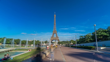Sunset view of Eiffel Tower timelapse hyperlapse with fountain in Jardins du Trocadero in Paris, France. Long shadows. People walking around. Eiffel Tower is one of the most iconic landmarks of Paris.の写真素材
