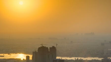 Sunrise with Cityscape of Ajman from rooftop timelapse. Ajman is the capital of the emirate of Ajman in the United Arab Emirates. 4Kの写真素材