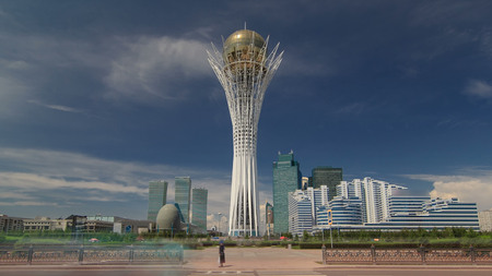 ASTANA, KAZAKHSTAN - JULY 2016: Bayterek timelapse hyperlapse is a monument and observation tower in Astana. The height of buildings 105 meters. Main symbol of city with modern buildings in the background. 4Kのeditorial素材