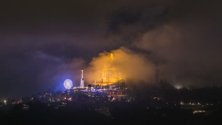 Temple of the Sacred Heart of Jesus with luna park timelapse on Tibidabo Mountain in Barcelona in...