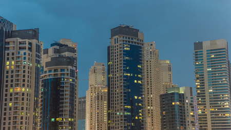 Towers of Dubai Marina in Dubai day to night transition timelapse, United Arab Emirates. Dubai...