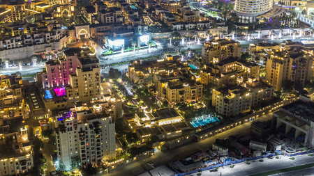 Top night view of the central area of the city timelapse Dubai downtown with illuminated houses and traffic on the road before new year celebrationの写真素材