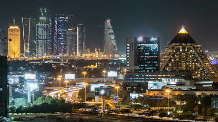 Scenic Dubai downtown skyline timelapse at night. Top view of Sheikh Zayed road with numerous...