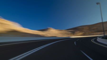 Drive on Curvy road through the Jebel Hafeet road timelapse hyperlapse fefore sunset, Al Ain, United Arab Emiratesの写真素材