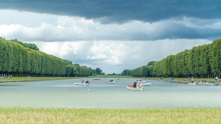 The Grand Canal of the Palace of Versailles with boats timelapse in France. The Palace of Versailles...