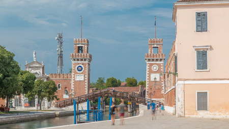 Entrance to the Arsenale timelapse, Venice, Veneto, Itlay and the Campo de l'Arsenale with the canal and Ponte de l'Arsenal o del Paradiso on a sunny day with few touristsの写真素材