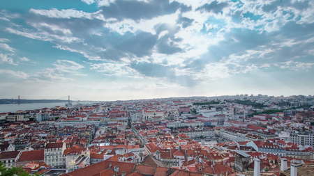 View of the historical Lisbon Baixa downtown and Tagus River, from the Sao Jorge St. George Castle in Lisbon, Portugal timelapse with clouds and sun with rays, bridge, 4Kの写真素材