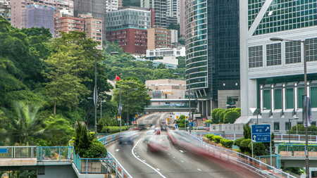 Hong Kong traffic timelapse near bank tower in Central District of Hong Kong. Skyscrapers, stunning...