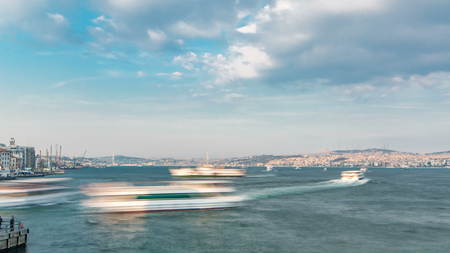 Tourist ship and ferris traffic on Bosphorus timelapse view from Galata Bridge in Istanbul, Turkey....