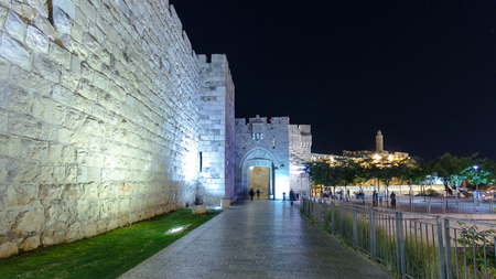 Walls of Ancient City at Night timelapse hyperlapse, Jerusalem, Israel. Walking people anong the...