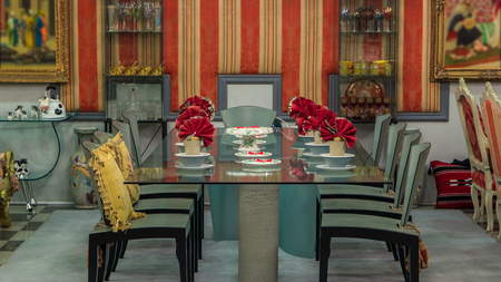 dining table and comfortable chairs in modern home with elegant table setting timelapse stop motion....