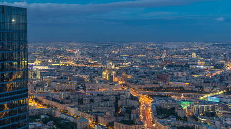 Aerial top view of Moscow city day to night timelapse after sunset. Form from the observation...
