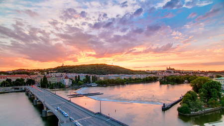 The View on Prague Hill Petrin timelapse with Owl's Mills and Jirasek Bridge after Sunset with beautiful colorful sky, Czech Republic. View from top of dancing houseの写真素材
