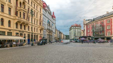 One of the symbol of Prague a tram - street car turning in Old Town (Stare Mesto) by Prague Namesti Republiky station timelapse. Prague, Czech Republic. Cloudy skyの写真素材