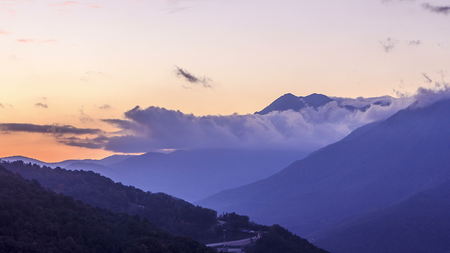 Autumn in High Mountains at sunset with dramatic clouds. Sochi, Russia. Krasnaya Polyana timelapse.