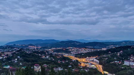 Panoramic view of Sochi city timelapse day to night transition - resort at Black Sea coast of Russia, Krasnodar krai. View from Dendrarium cable car station 4Kの写真素材