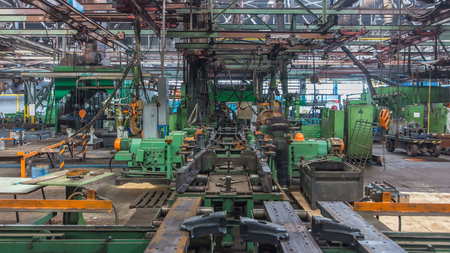 Conveyor assembly stage the body of tractor at factory timelapse. Frames assembly with red-hot...