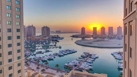 Sunset at the Pearl-Qatar timelapse from top. It is an artificial island in Qatar. View of the...